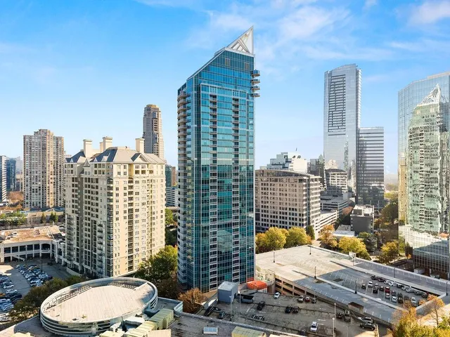 a view of balcony with a couple of chairs