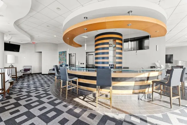 a balcony with table and chairs