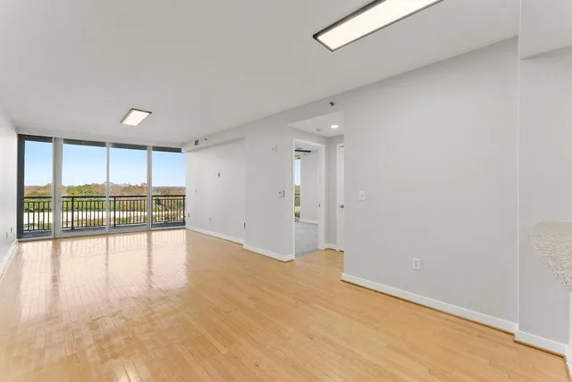 a view of an empty room with a window