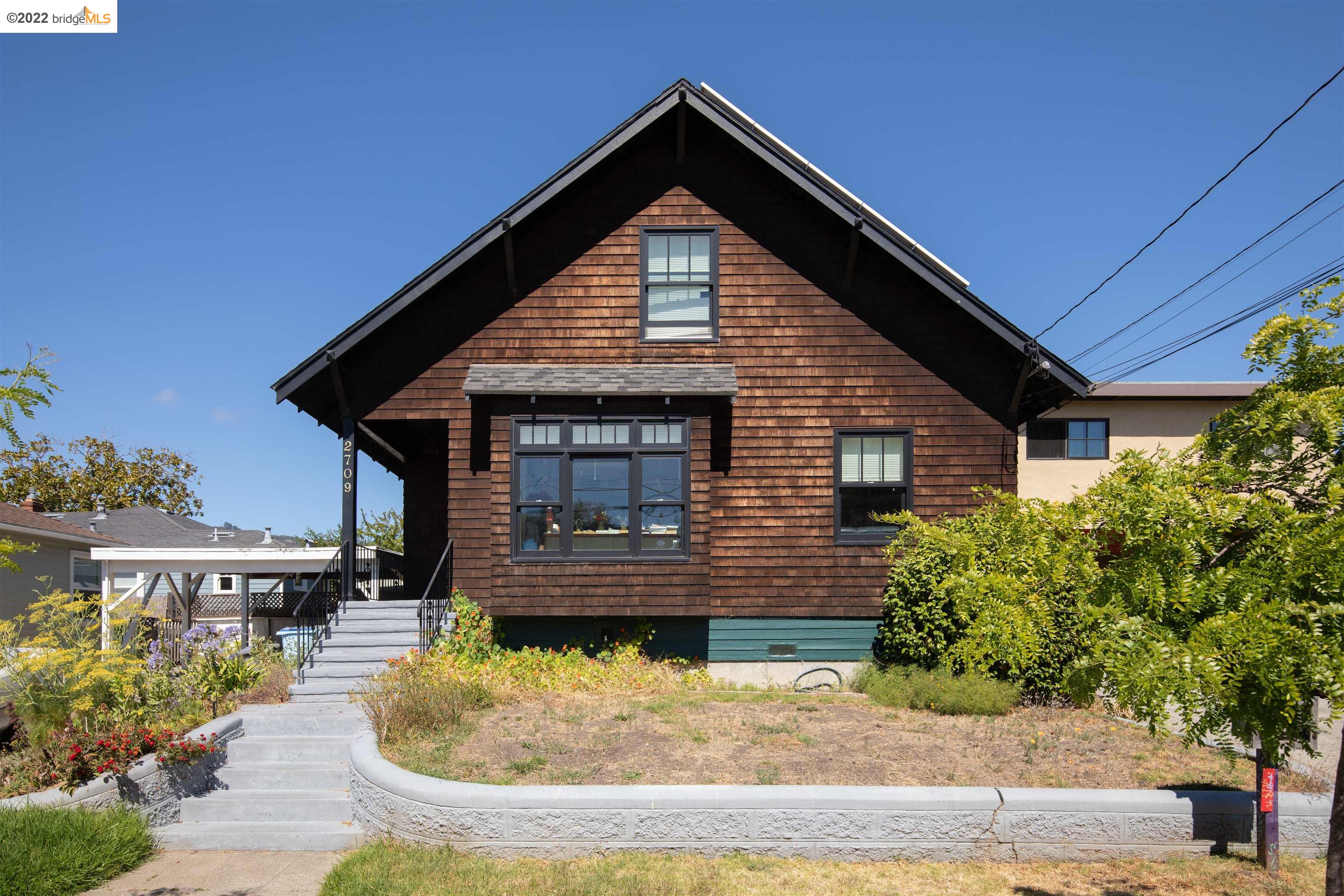 2709 McGee Avenue Berkeley, CA 94703 - Photo 1 of 1 a front view of a house with a yard