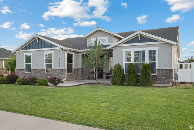 1074 South 750 West Springville, UT 84663 - Photo 3 of 28 Single-story residence featuring a gray stucco exterior with stone accents and a dark shingle roof