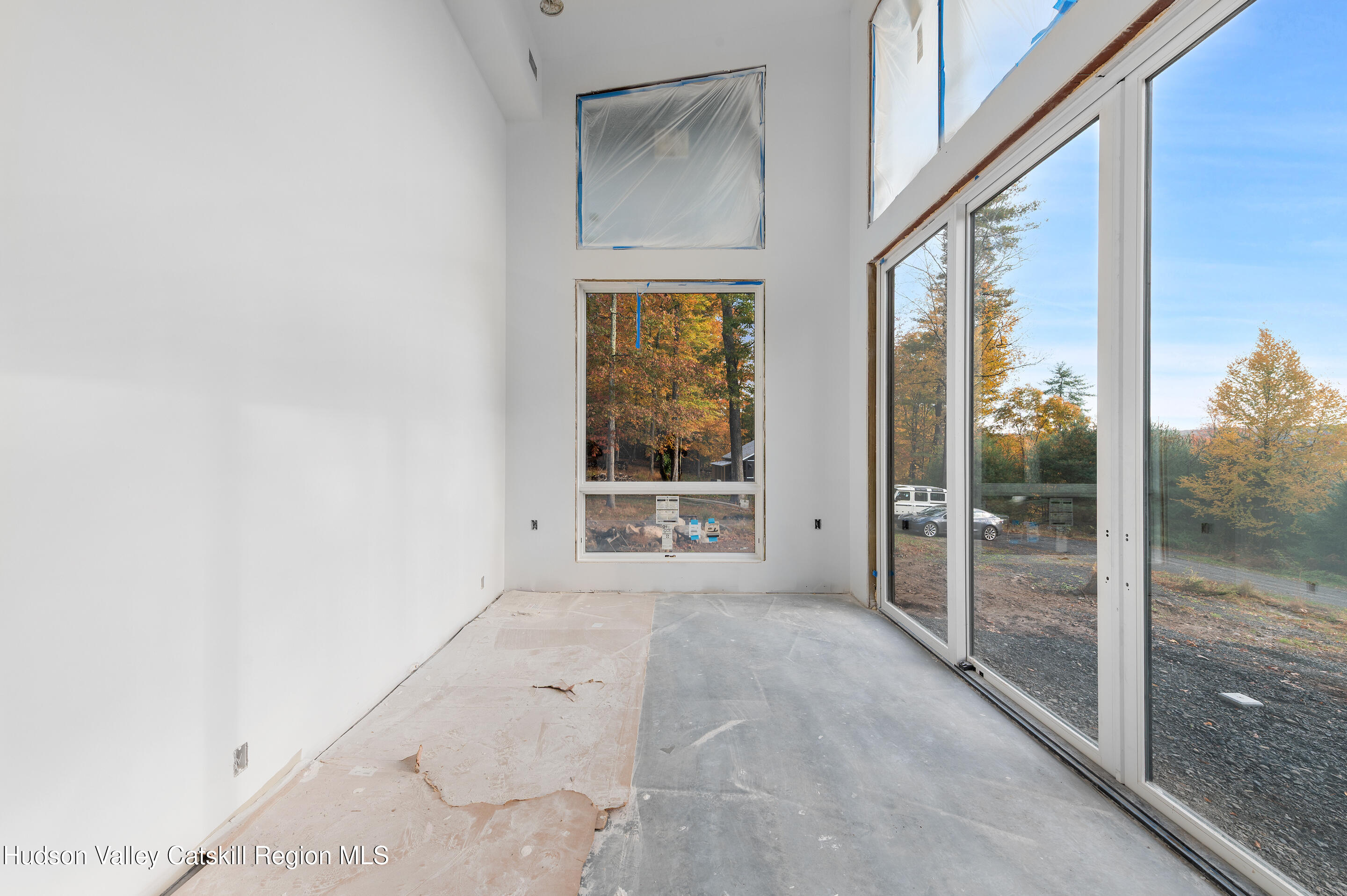 185 Stone Church Road Marbletown, NY 12401 - Photo 12 of 43 a view of an empty room with glass door