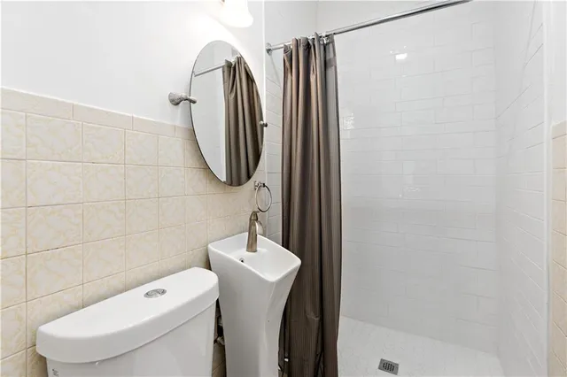 a bathroom with a toilet and a sink