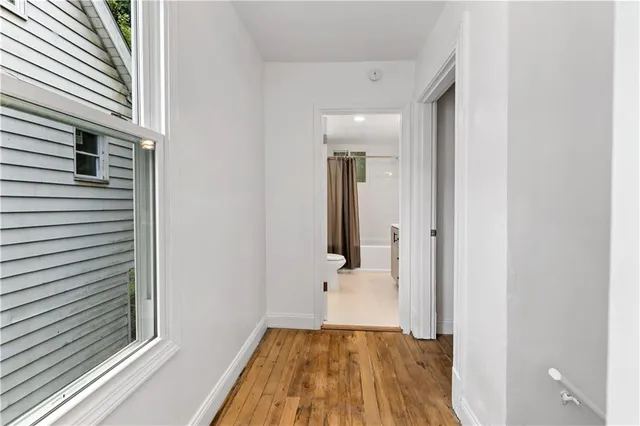 a bathroom with a sink a mirror a vanity and a shower