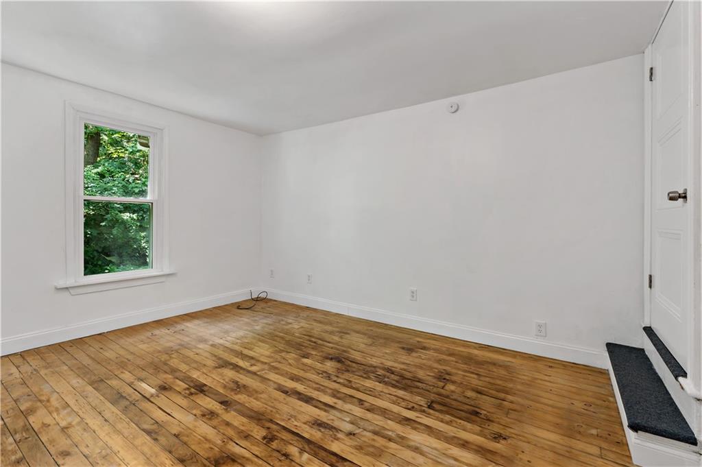 428 Card Avenue Wilmerding, PA 15148 - Photo 20 of 32 a view of empty room with wooden floor and fan