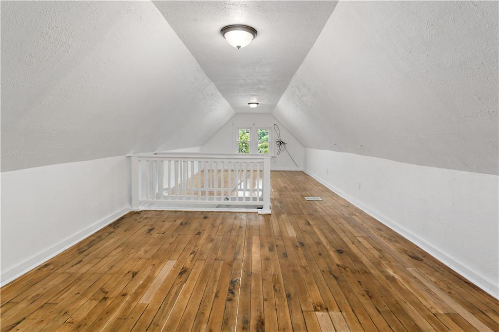 428 Card Avenue Wilmerding, PA 15148 - Photo 24 of 32 a view of an empty room with wooden floor and a window