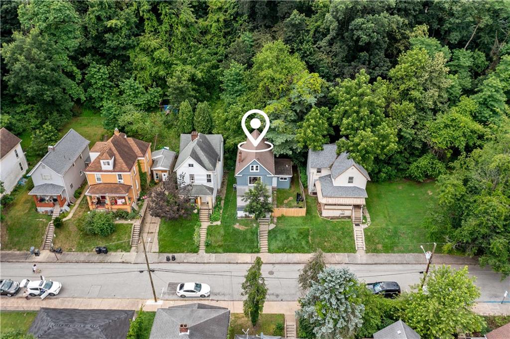 428 Card Avenue Wilmerding, PA 15148 - Photo 31 of 32 an aerial view of a residential apartment building with a yard and parking spaces