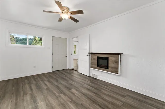 wooden floor in an empty room with a fireplace