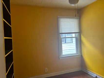 a view of front door with wooden floor