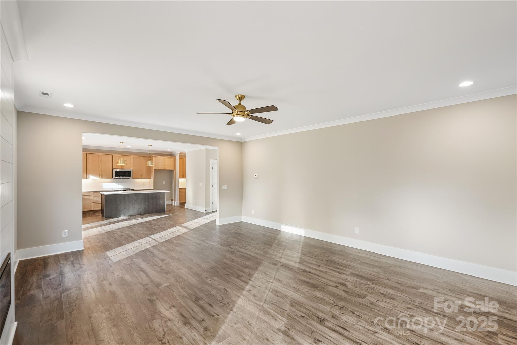 1917 Snyders Store Road, Unit 6 Wingate, NC 28174 - Photo 11 of 46 wooden floor in an empty room with a window