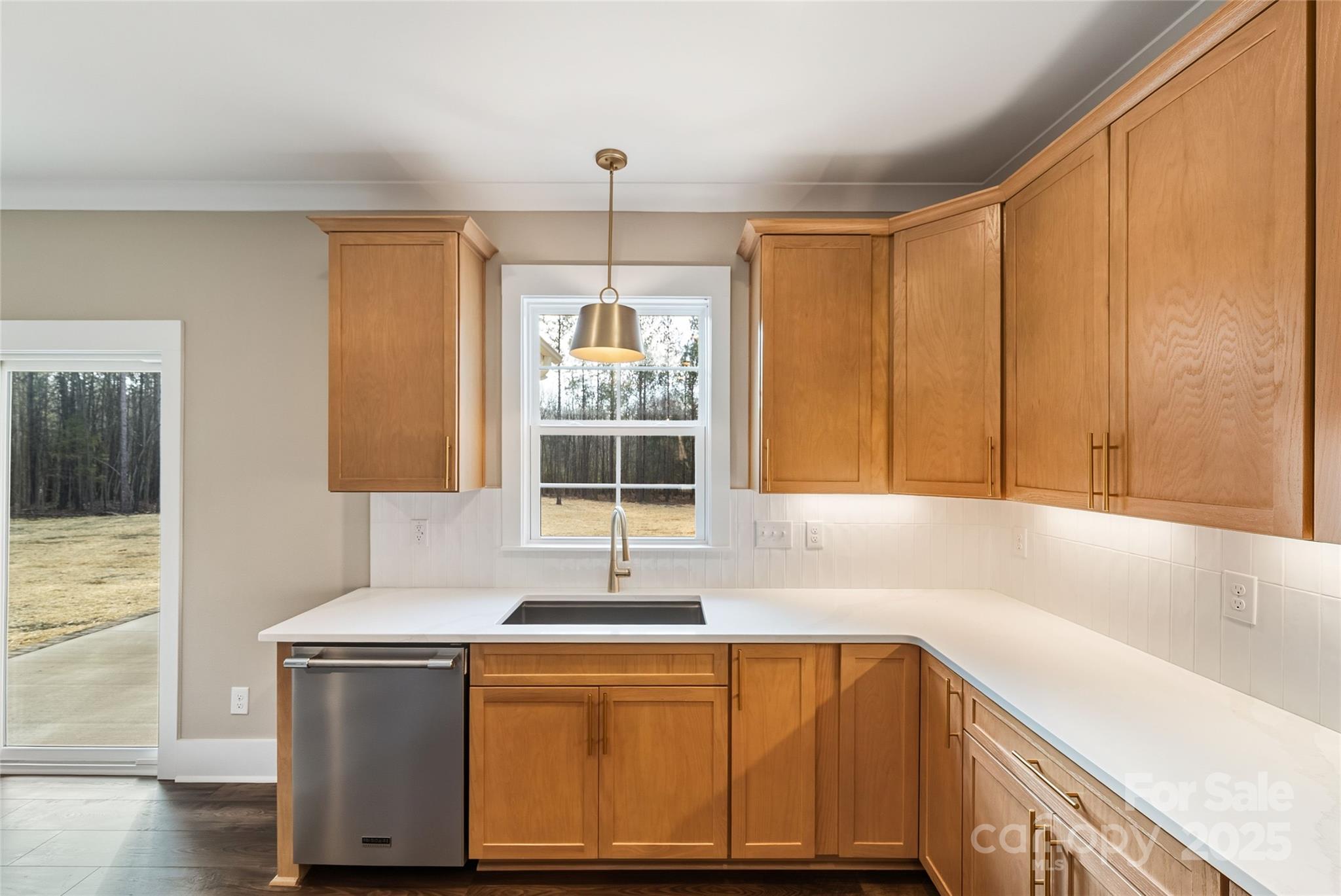 1917 Snyders Store Road, Unit 6 Wingate, NC 28174 - Photo 17 of 46 a kitchen with stainless steel appliances granite countertop a sink and a granite counter tops with wooden floors