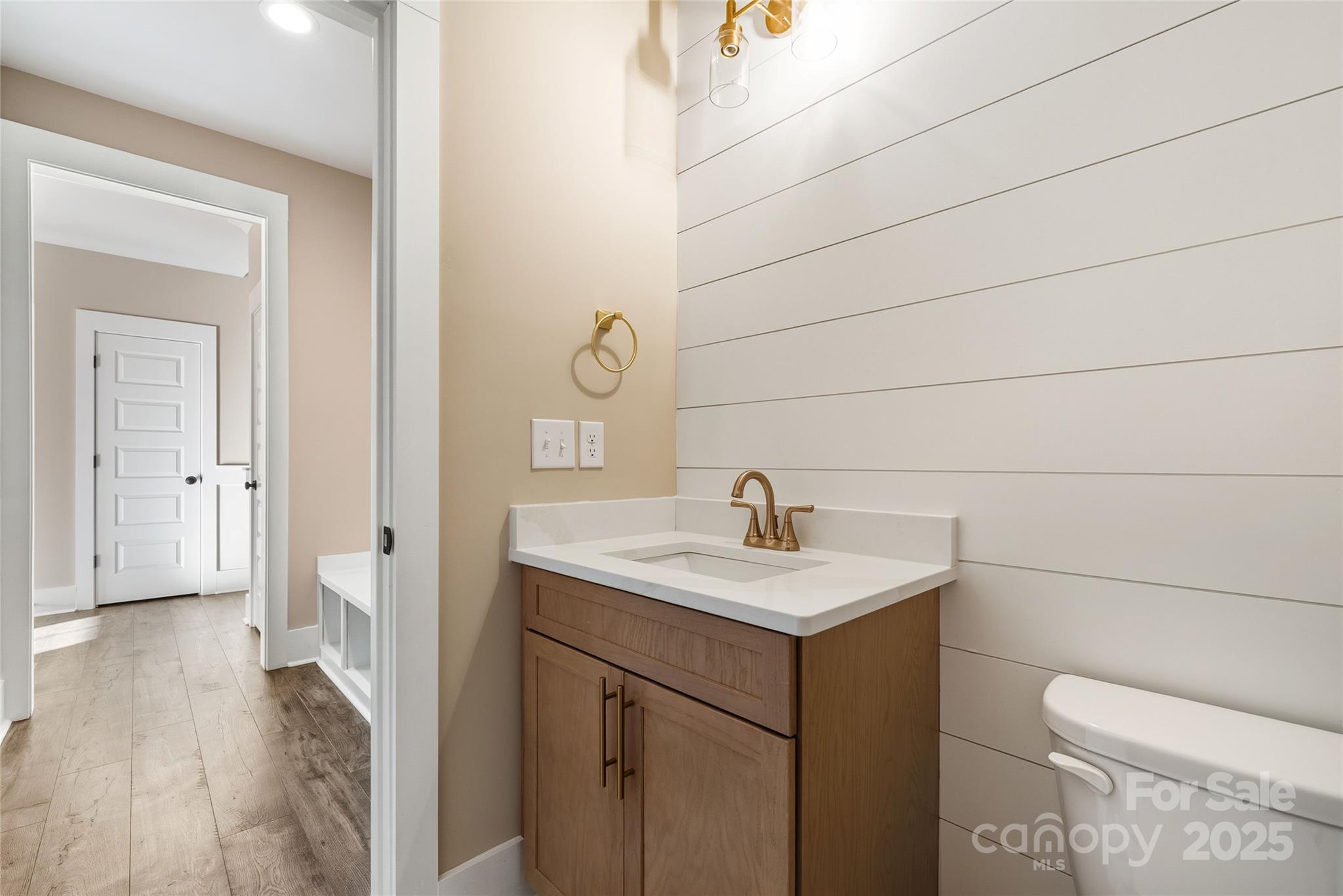 1917 Snyders Store Road, Unit 6 Wingate, NC 28174 - Photo 19 of 46 a bathroom with a sink toilet and vanity
