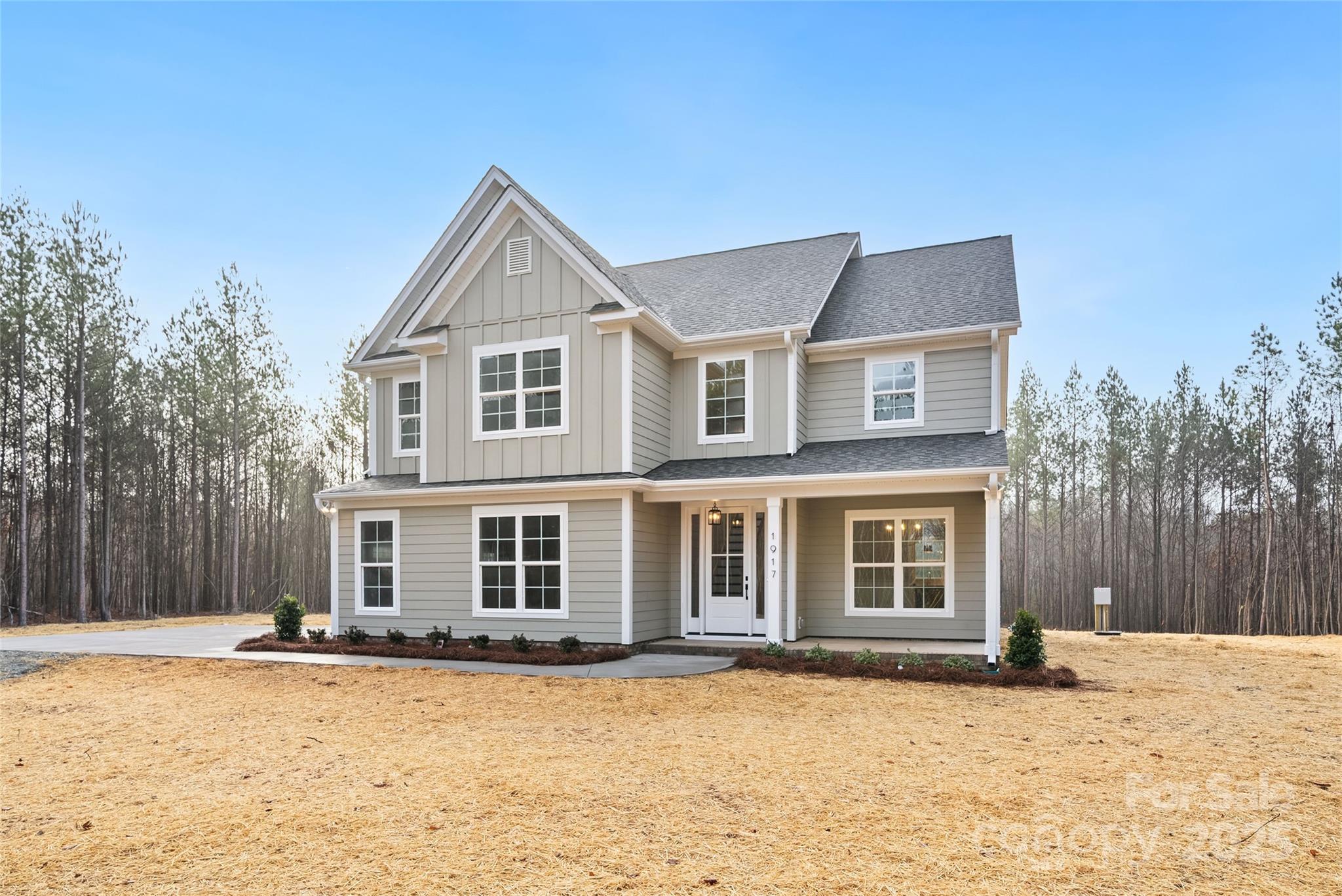 1917 Snyders Store Road, Unit 6 Wingate, NC 28174 - Photo 2 of 46 a front view of a house with a yard