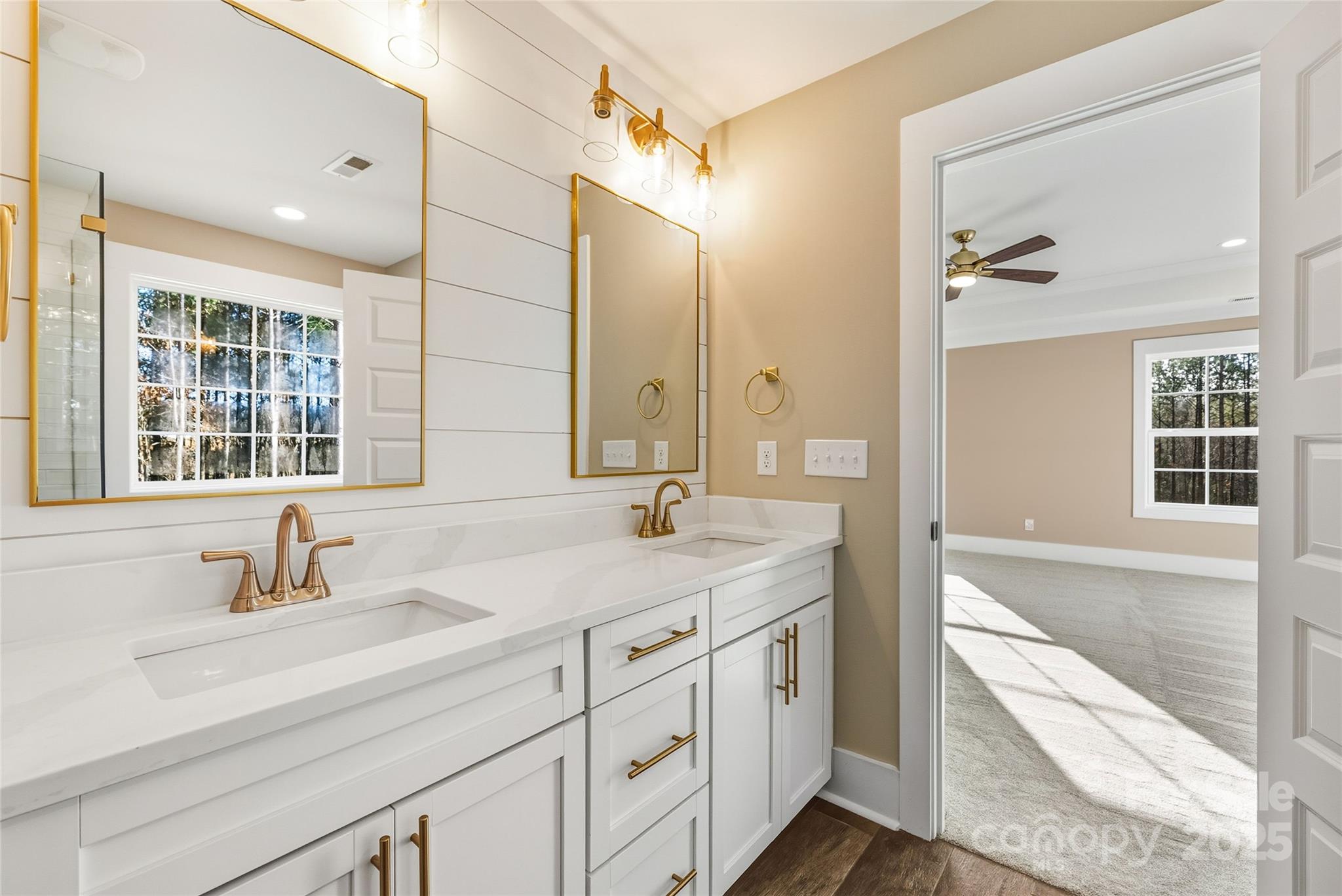 1917 Snyders Store Road, Unit 6 Wingate, NC 28174 - Photo 26 of 46 a bathroom with a sink double vanity and a tub