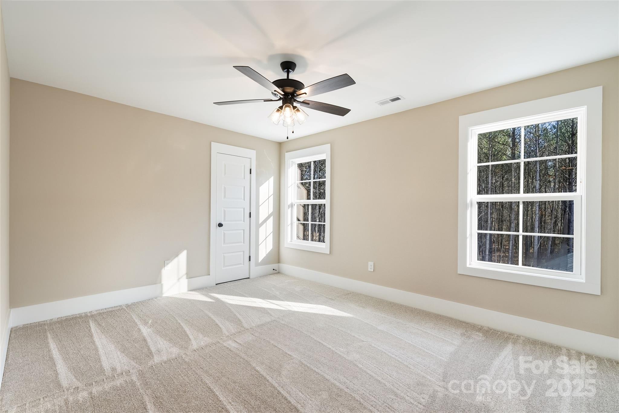 1917 Snyders Store Road, Unit 6 Wingate, NC 28174 - Photo 30 of 46 a view of a livingroom with a ceiling fan and window