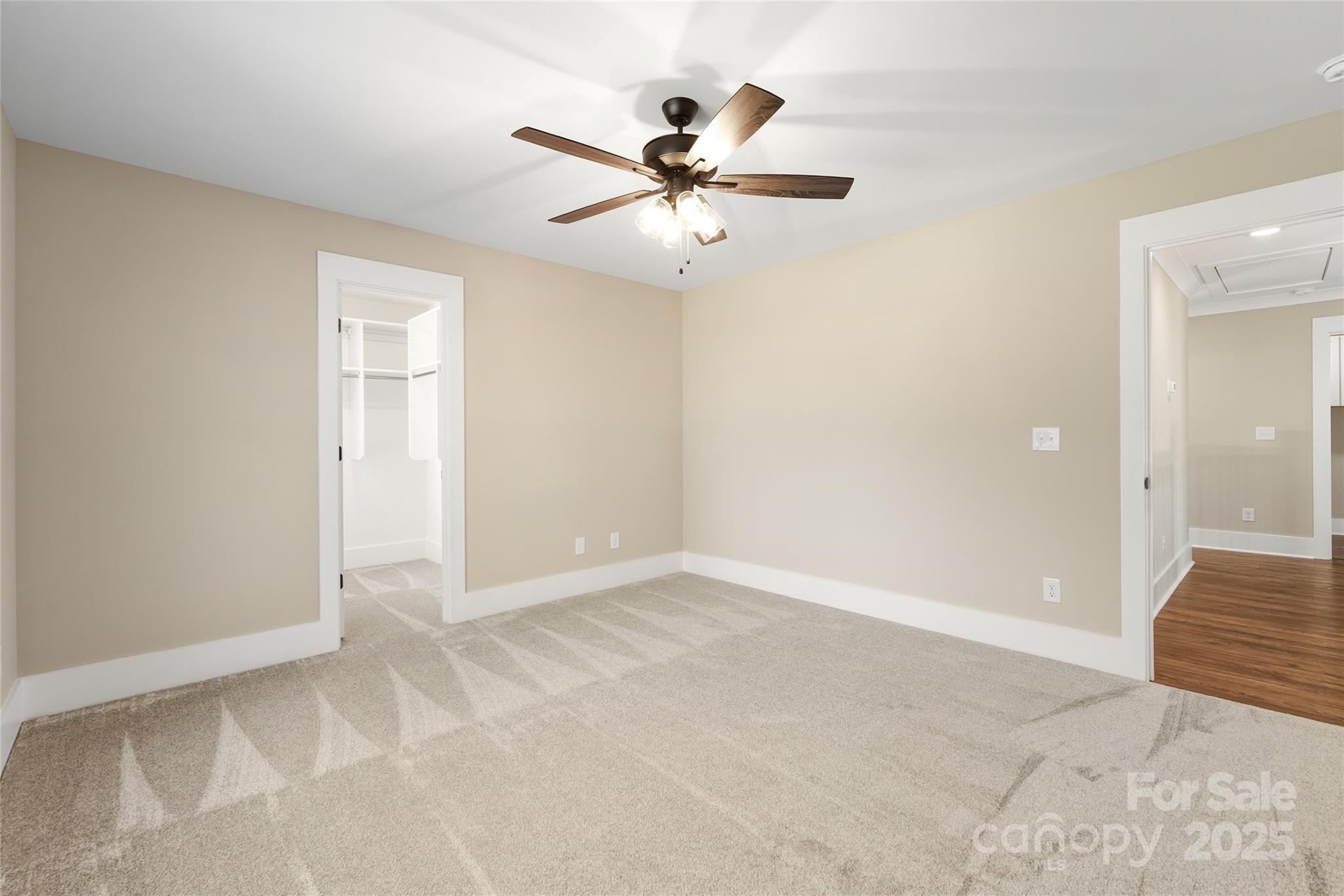 1917 Snyders Store Road, Unit 6 Wingate, NC 28174 - Photo 32 of 46 an empty room with ceiling fan and window