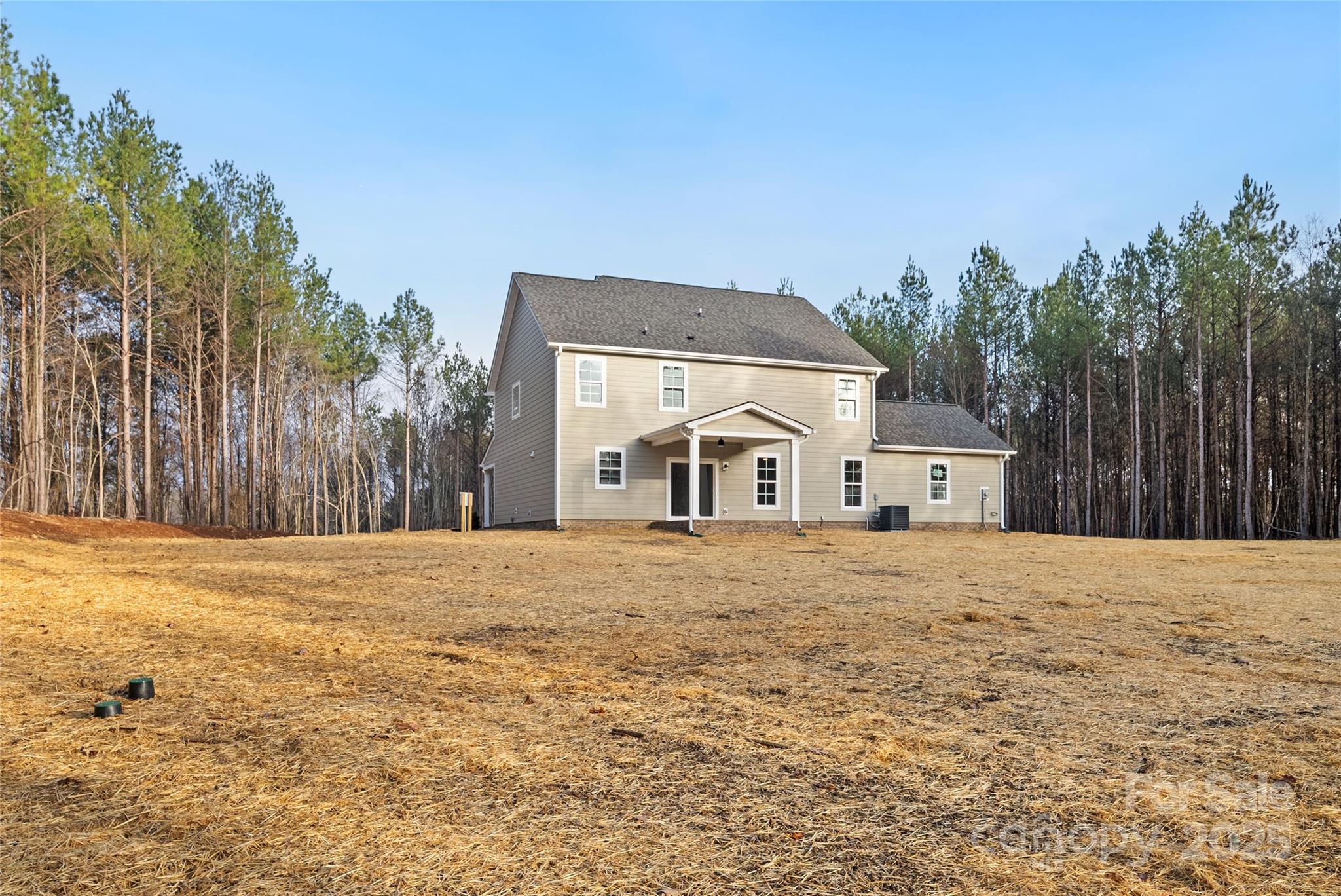 1917 Snyders Store Road, Unit 6 Wingate, NC 28174 - Photo 42 of 46 a house with trees in front of it