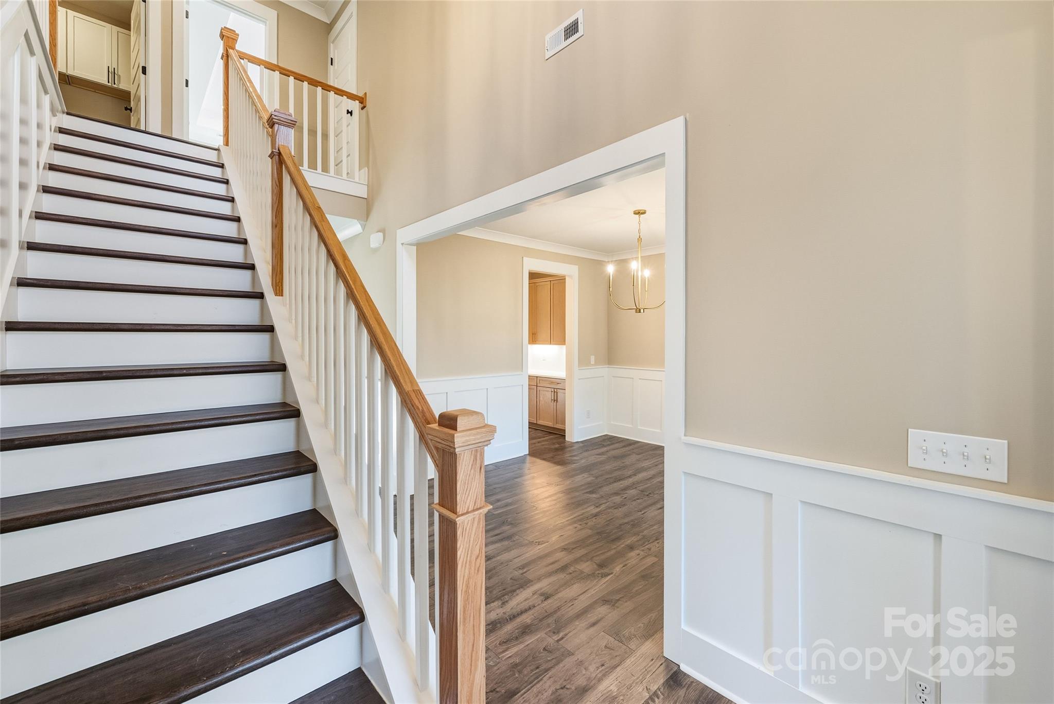1917 Snyders Store Road, Unit 6 Wingate, NC 28174 - Photo 5 of 46 a view of entryway and hall with wooden floor
