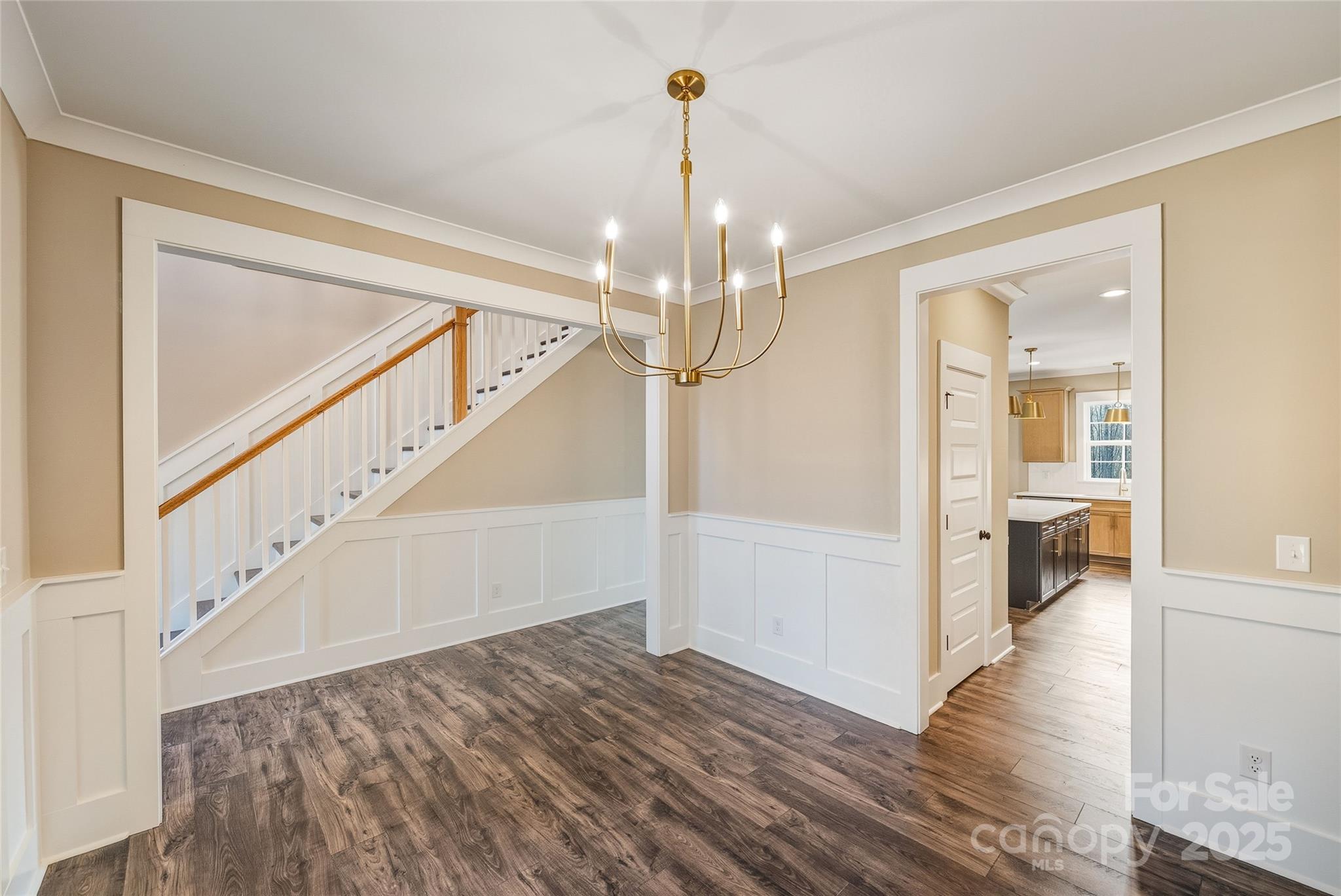 1917 Snyders Store Road, Unit 6 Wingate, NC 28174 - Photo 9 of 46 a view of a hallway view with wooden floor and staircase