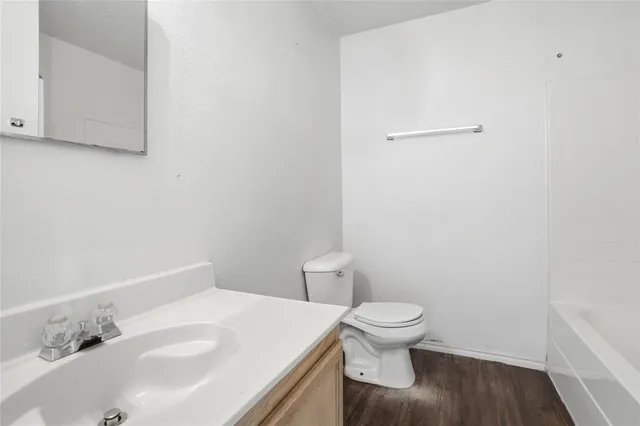 a view of an entryway with wooden floor