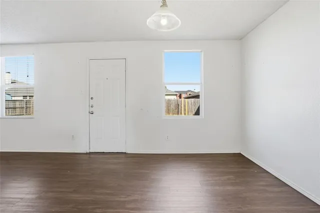 an empty room with windows