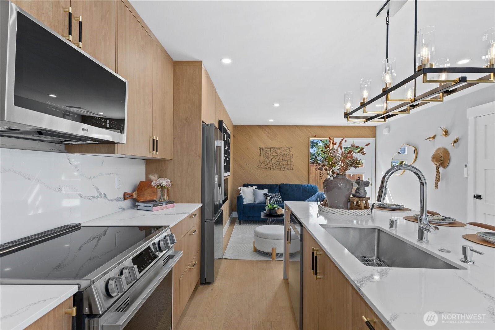 9537 Dayton Avenue North Seattle, WA 98103 - Photo 13 of 22 a kitchen with a sink stove and microwave