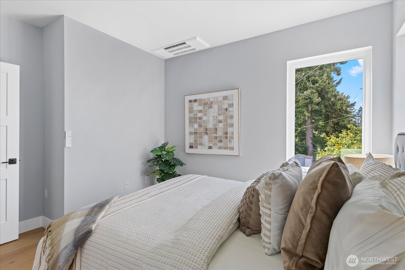 9537 Dayton Avenue North Seattle, WA 98103 - Photo 19 of 22 a bedroom with a bed and a window