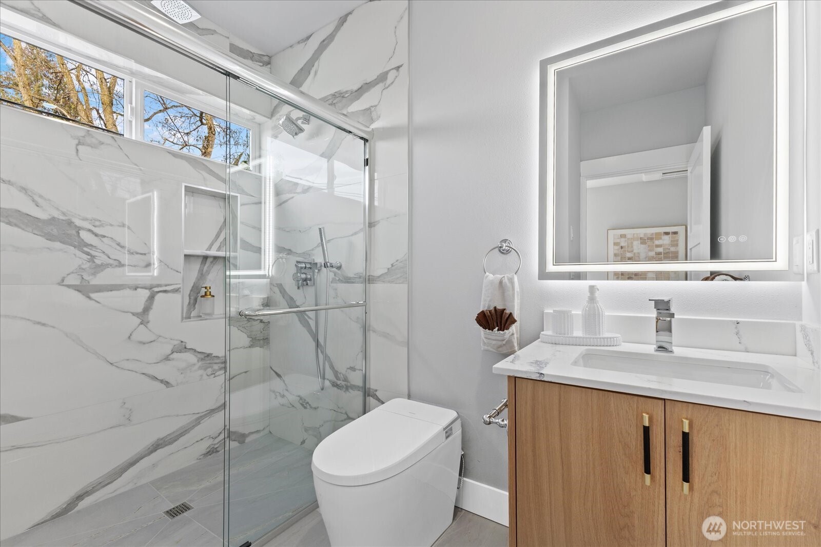 9537 Dayton Avenue North Seattle, WA 98103 - Photo 20 of 22 a bathroom with a granite countertop sink toilet and shower