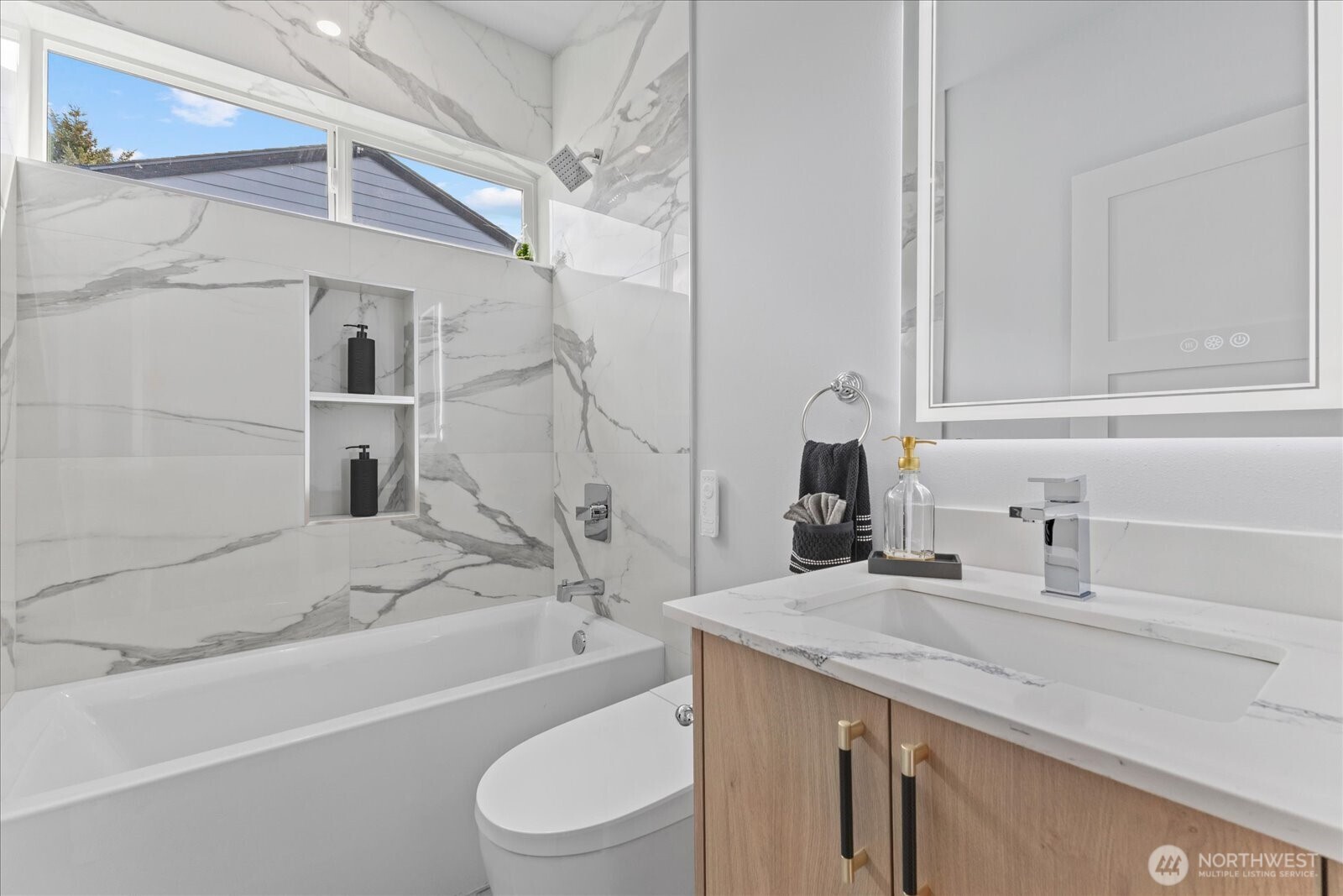 9537 Dayton Avenue North Seattle, WA 98103 - Photo 21 of 22 a bathroom with a granite countertop bathtub sink vanity mirror and toilet