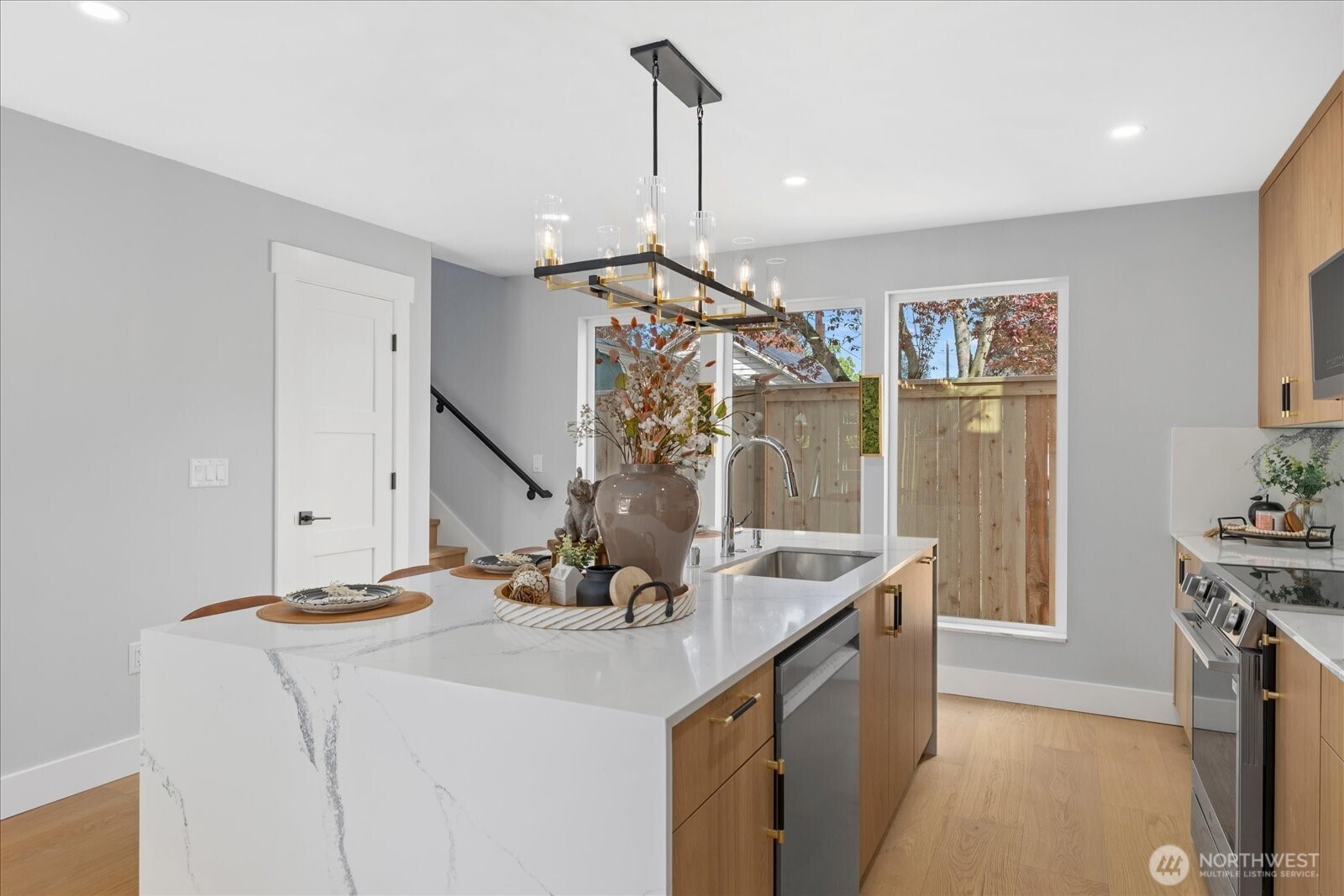 9537 Dayton Avenue North Seattle, WA 98103 - Photo 10 of 22 a view of kitchen island with sink and refrigerator