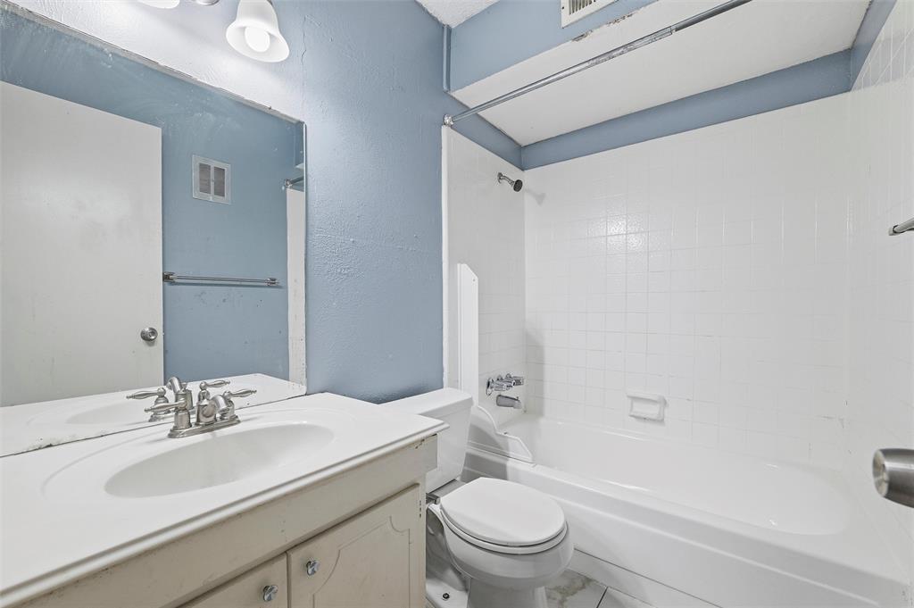 5604 Boca Raton Boulevard, Unit 248 Fort Worth, TX 76112 - Photo 20 of 25 a bathroom with a sink toilet and shower