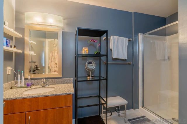 a bathroom with a sink toilet and mirror