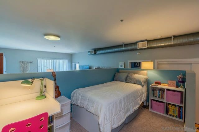 a bedroom with a bed and a closet