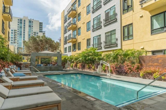 a view of a swimming pool with a lounge chairs