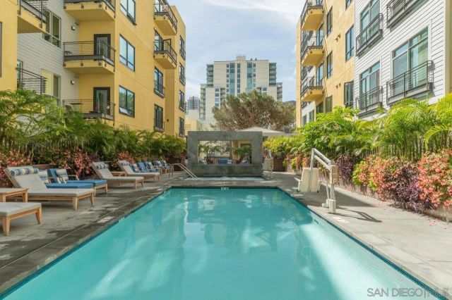 a view of a building with garden and sitting area
