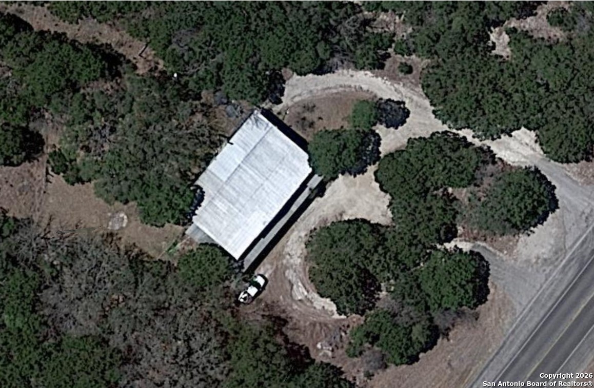 7321 Highway 173 Bandera, TX 78003 - Photo 2 of 28 a view of a tree in front of a yard