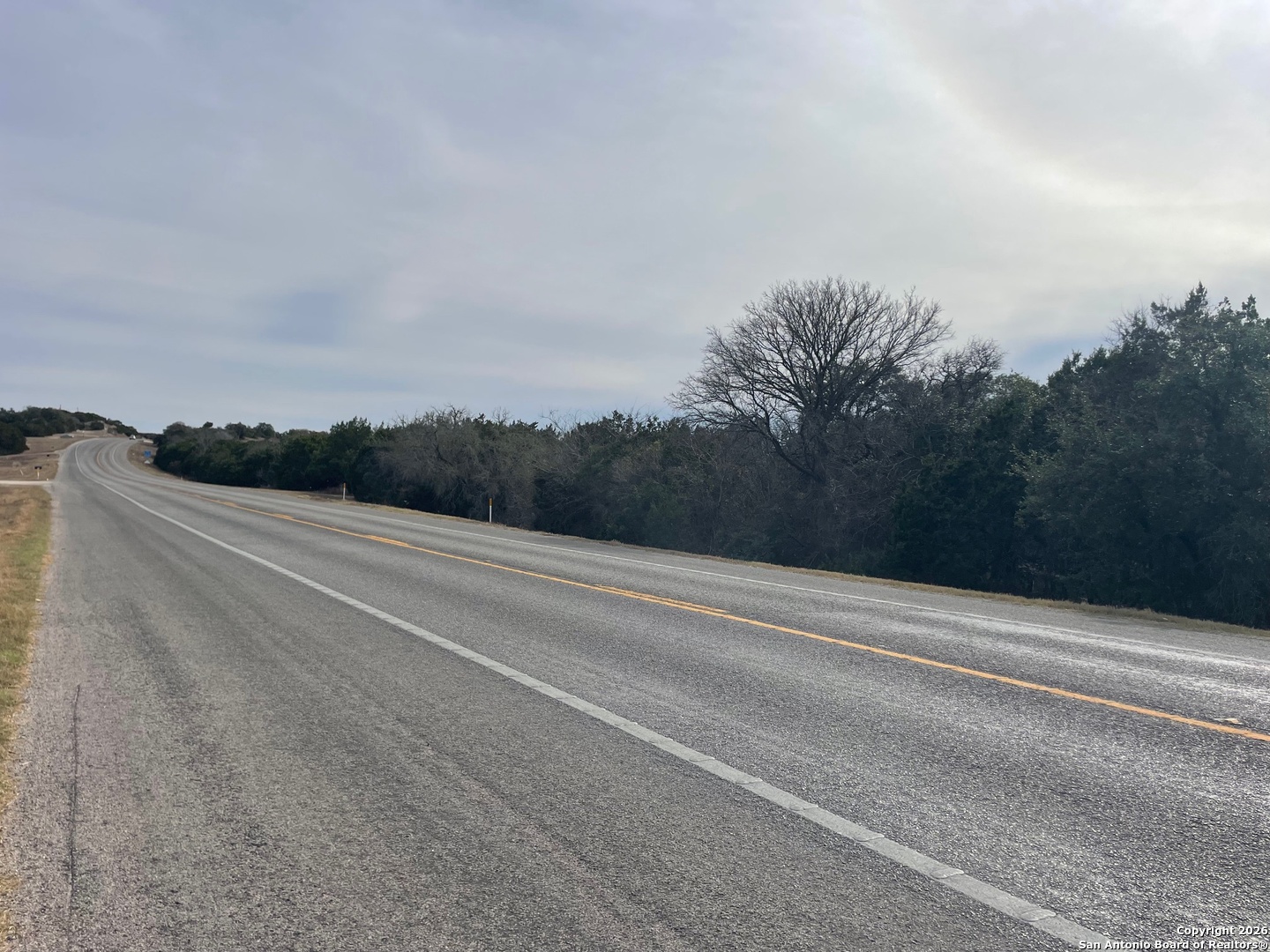 7321 Highway 173 Bandera, TX 78003 - Photo 26 of 28 a view of a field with trees in the background