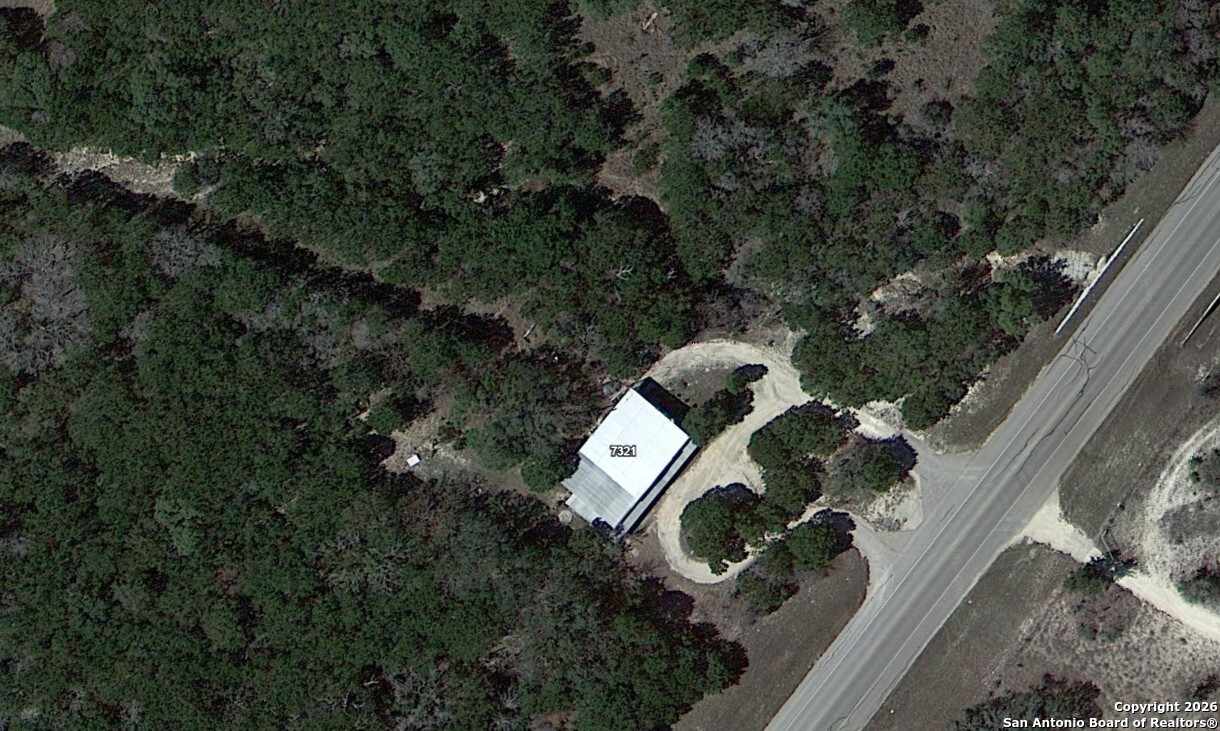 7321 Highway 173 Bandera, TX 78003 - Photo 3 of 28 an aerial view of a house with outdoor space and street view