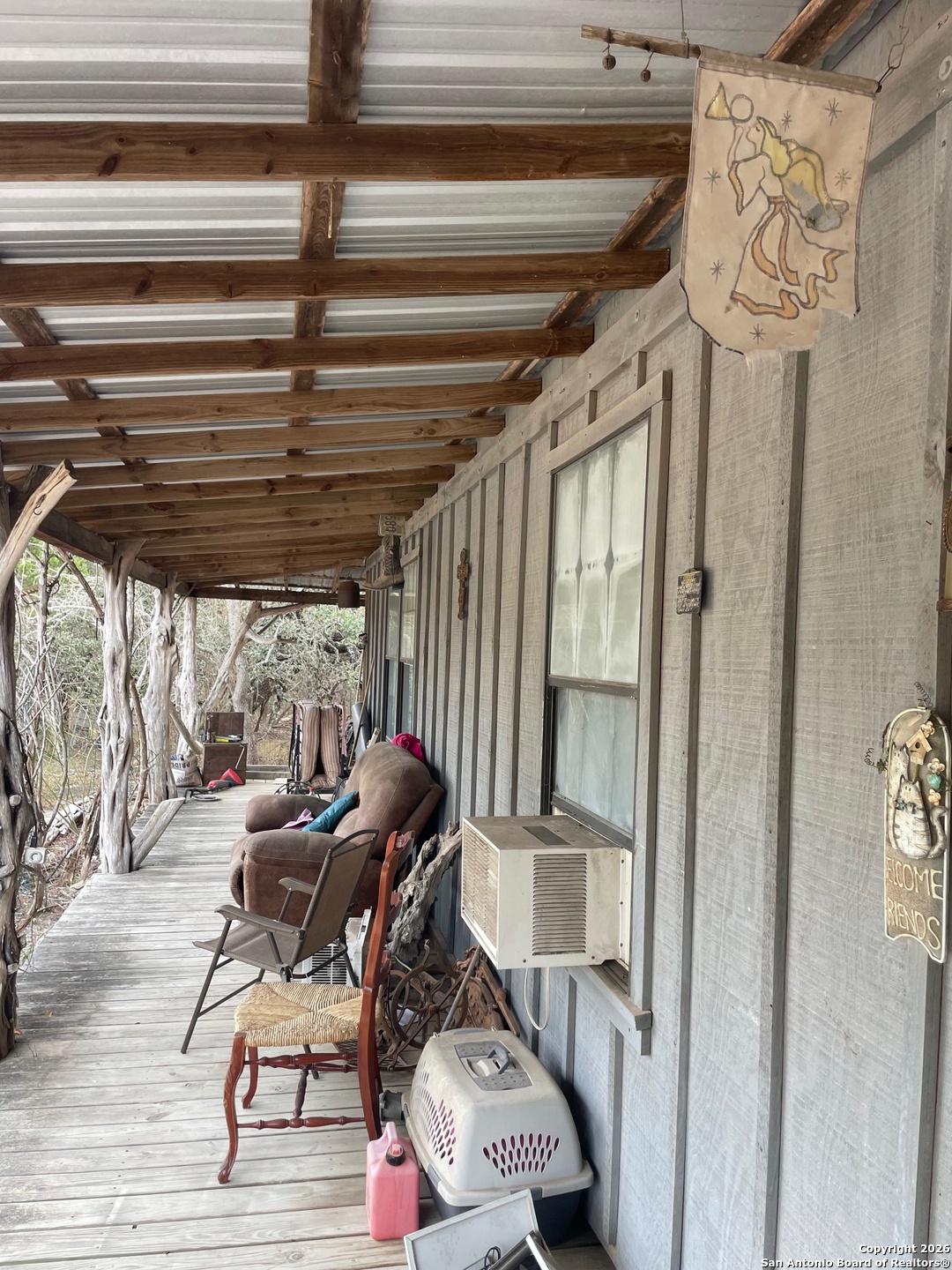 7321 Highway 173 Bandera, TX 78003 - Photo 5 of 28 a patio with table and chairs