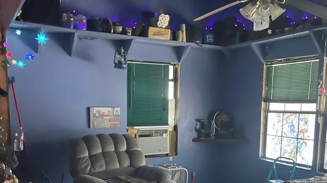 a living room with furniture and a window