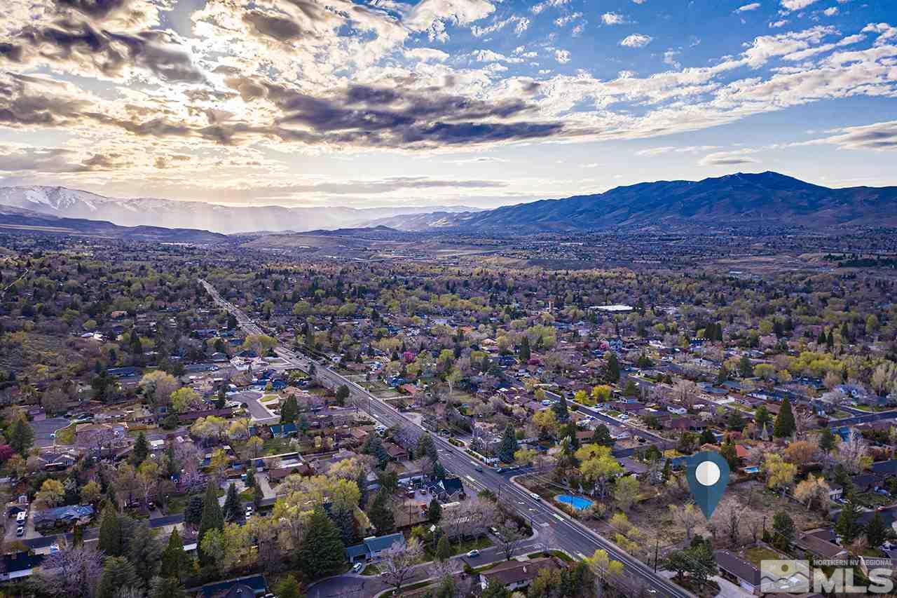1133 West Plumb Lane Reno, NV 89509 - Photo 3 of 6 an aerial view of residential houses and city view