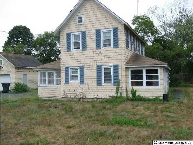 241 Drum Point Road Brick, NJ 08723 - Photo 1 of 3 a front view of a house with yard