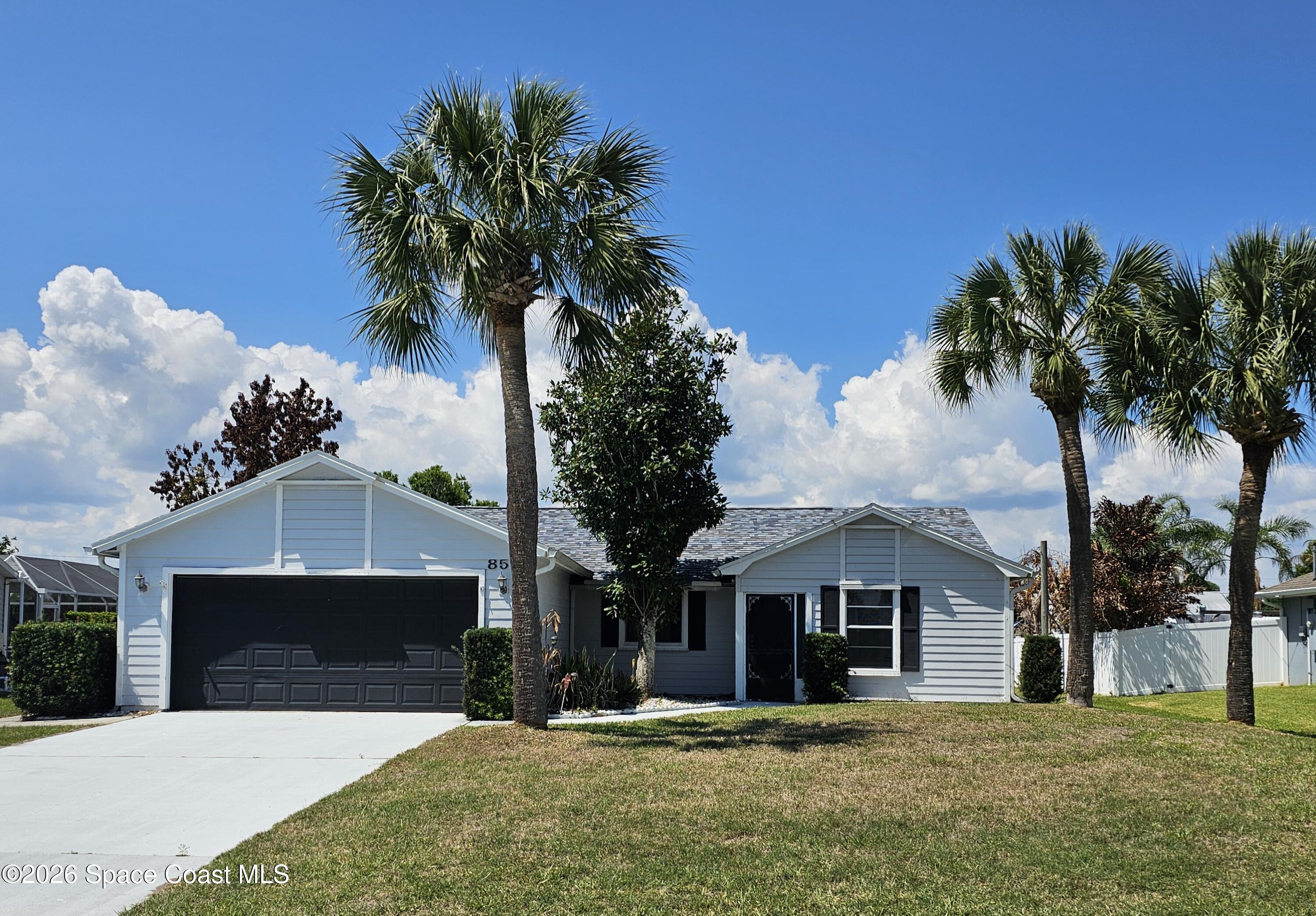 854 Dale Circle Sebastian, FL 32958 - Photo 1 of 31 a front view of a house with a garden