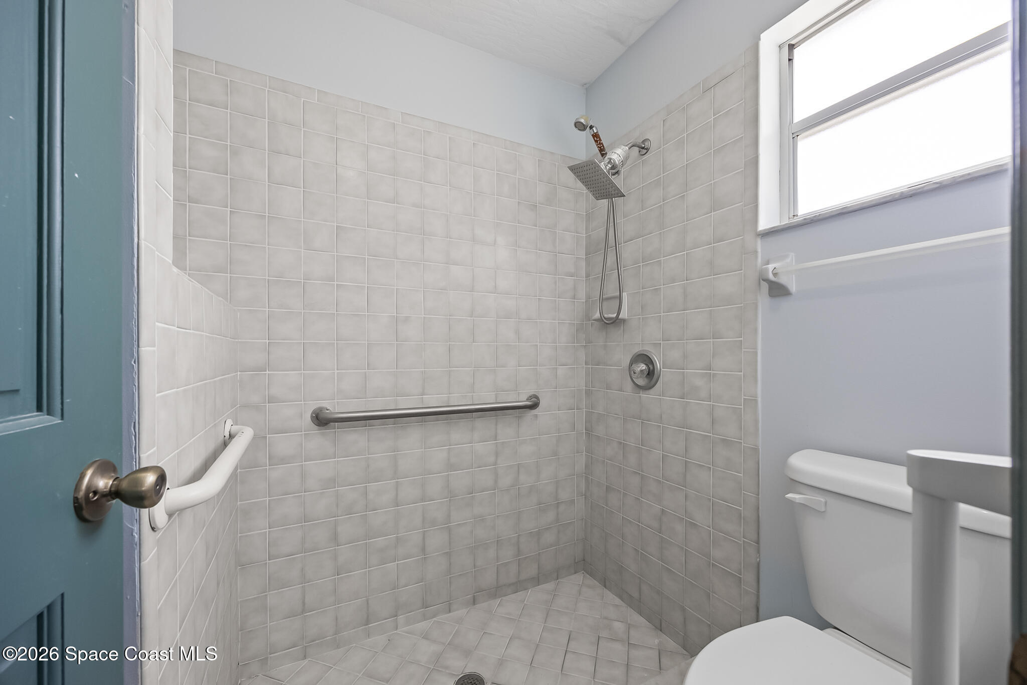 854 Dale Circle Sebastian, FL 32958 - Photo 15 of 31 a bathroom with a toilet and shower