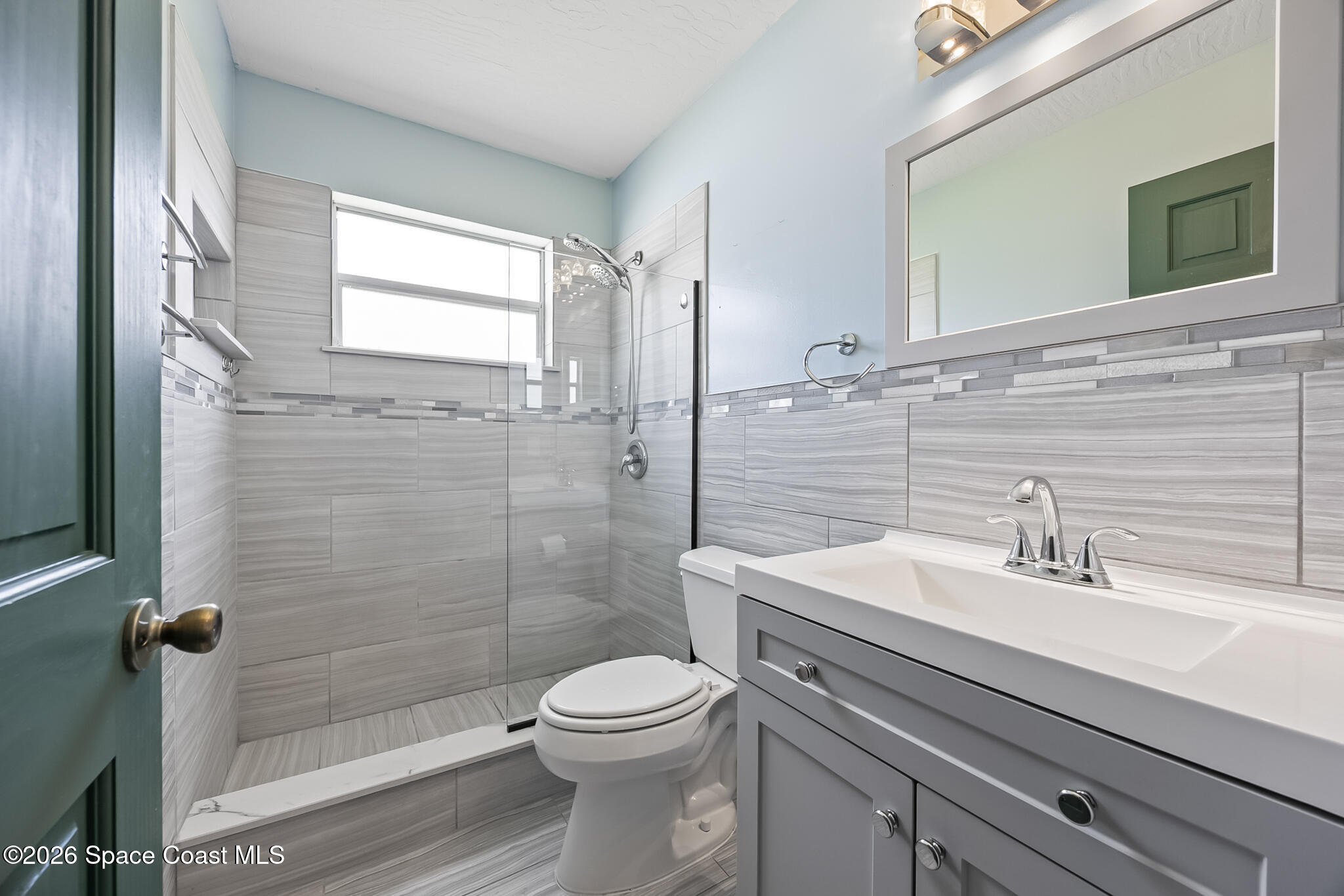 854 Dale Circle Sebastian, FL 32958 - Photo 16 of 31 a bathroom with a sink a toilet and shower