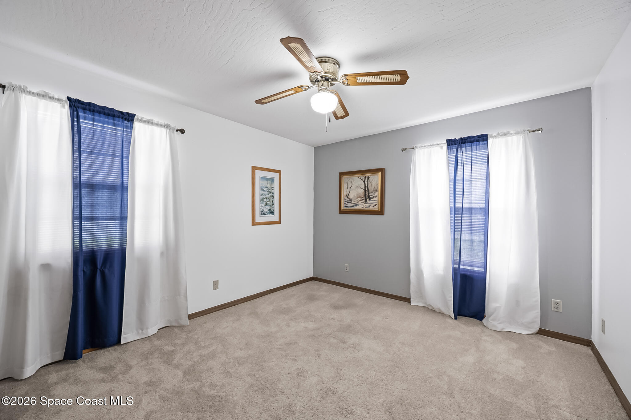 854 Dale Circle Sebastian, FL 32958 - Photo 17 of 31 a view of a livingroom with a ceiling fan and windows