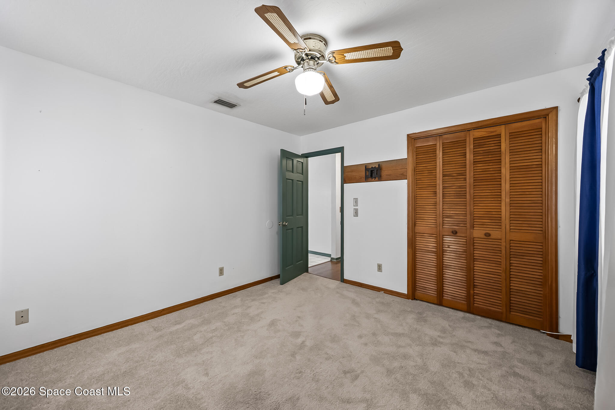 854 Dale Circle Sebastian, FL 32958 - Photo 20 of 31 an empty room with closet and ceiling fan