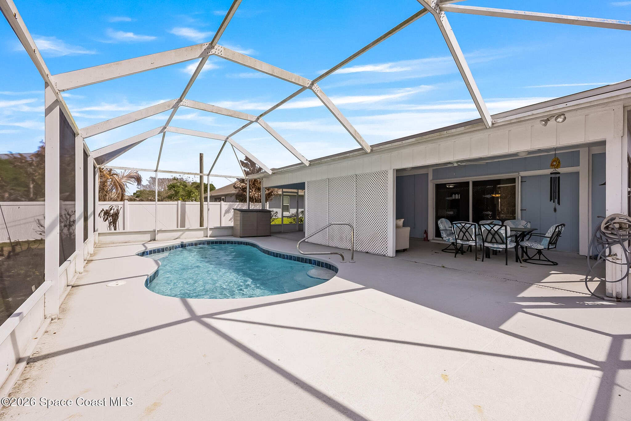 854 Dale Circle Sebastian, FL 32958 - Photo 24 of 31 a view of a patio with a table and chairs under an umbrella