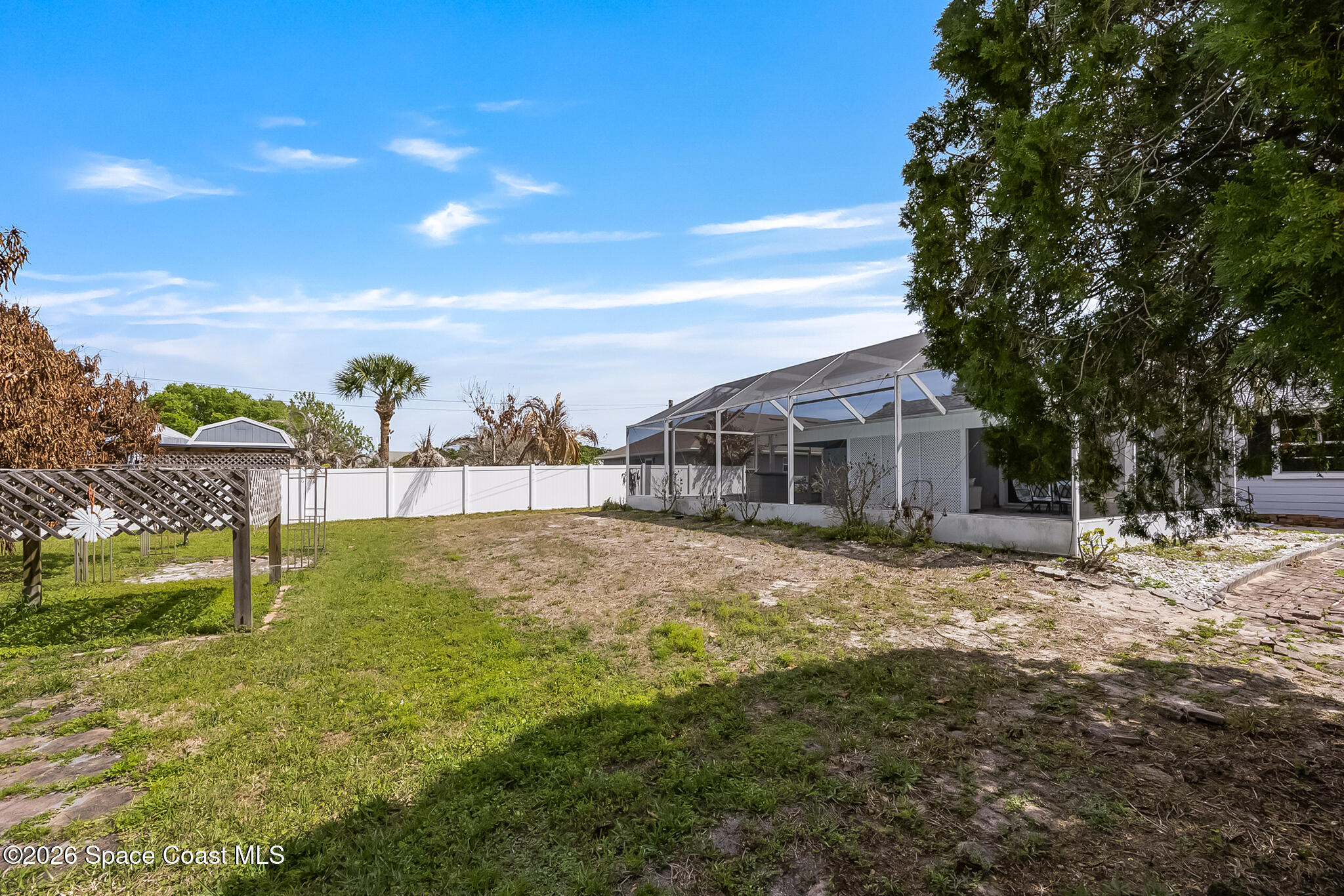 854 Dale Circle Sebastian, FL 32958 - Photo 29 of 31 a backyard of a house with table and chairs