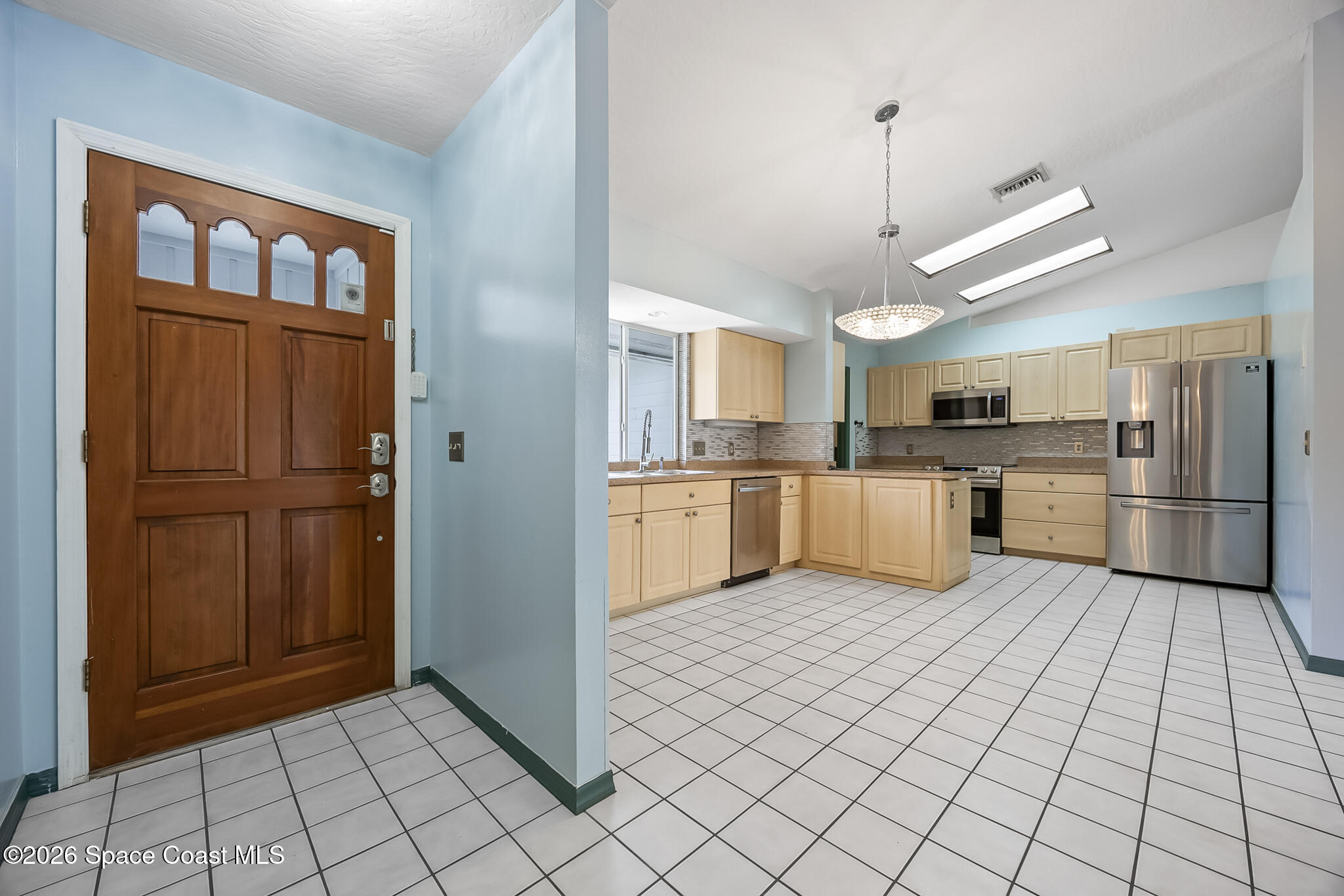 854 Dale Circle Sebastian, FL 32958 - Photo 3 of 31 a large kitchen with cabinets and stainless steel appliances
